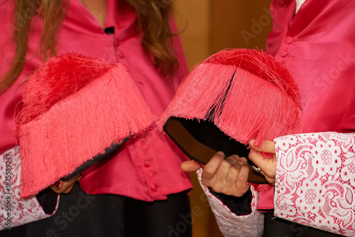 Graduates holding academic caps celebrating university graduation ceremony