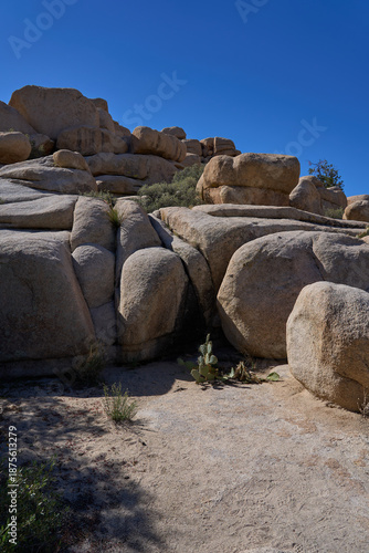 Joshua Tree National Park, CA, USA - October 19, 2025 - Towering granite rock formations under a clear blue desert sky