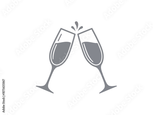 Two champagne glasses clinking together in celebration.