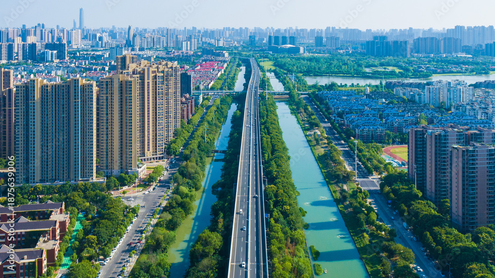 Naklejka premium Wuhan Aerial City View with Green Canals and Modern Skyline
