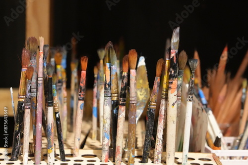 Paint Brushes Covered With Colorful Paint in Creative Studio