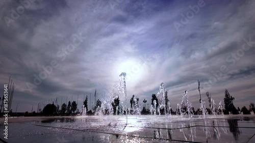 Beautiful view of a small fountain at sunset.