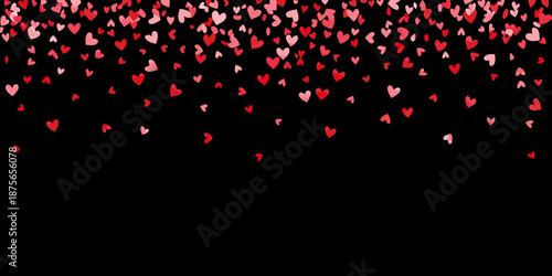 a large number of red and pink hearts floating on black background