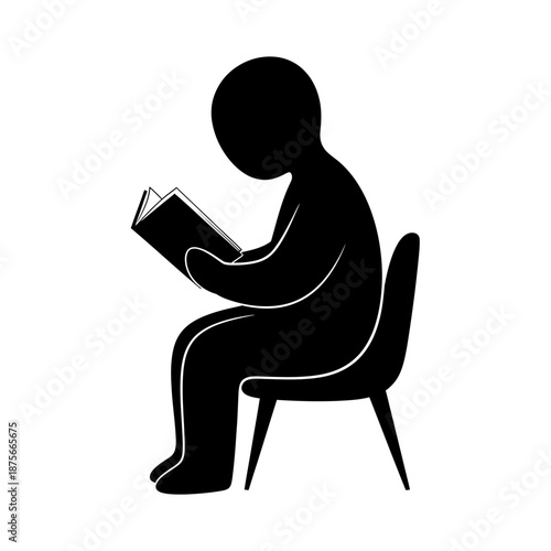 Child Sitting on Chair Reading Book.