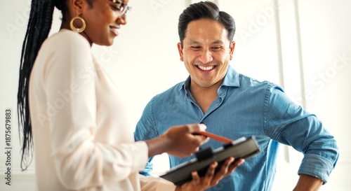 Photography A smiling man and woman discussing work