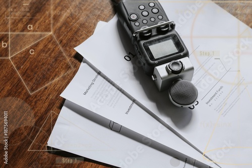 Tableau sur toile Portable sound recorder on a wooden table