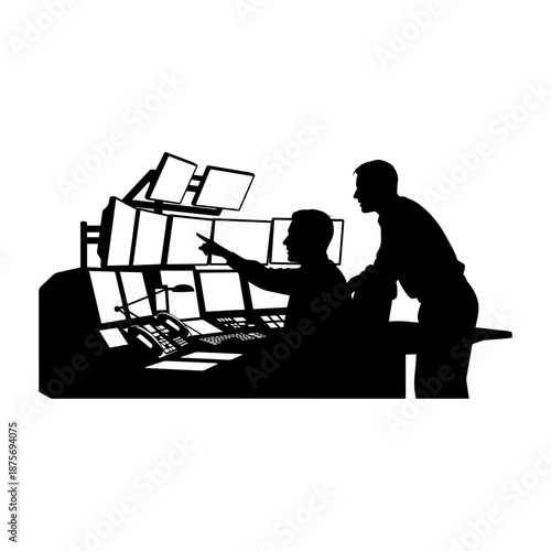 Silhouette of Two Professionals Working Together at Computer Workstation.
