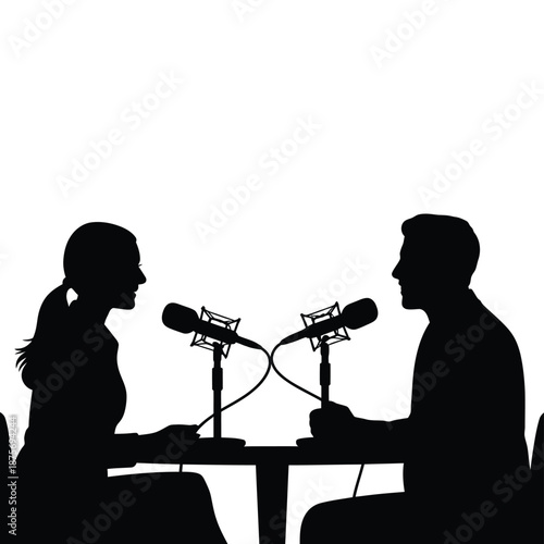 silhouette of two people sitting at a table with microphones