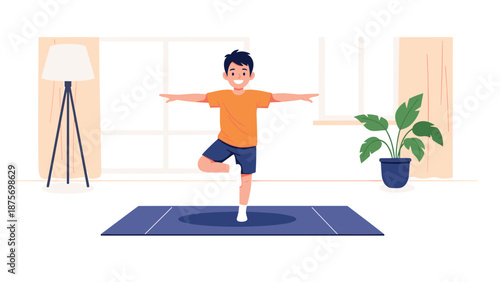 Happy young boy practicing yoga balance in the tree pose on a blue mat in a bright and airy modern living room setting.