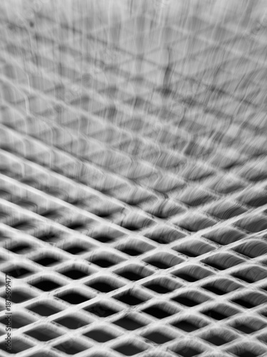 abstract blur motion of metal grid or grate with long time exposure and intentional camera movement to shoot blur in motion creating special effects