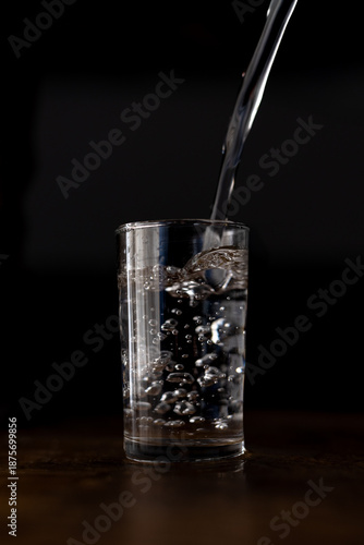 Low-key shot of pouring water