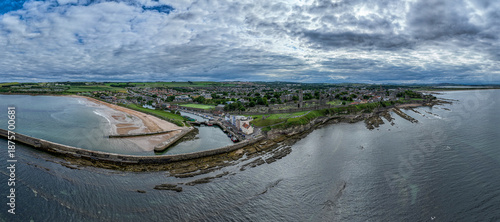 Aerial view of St Andrews a town on the east coast of Fife in Scotland. St Andrews Cathedral and castle, view of the coast and its green areas