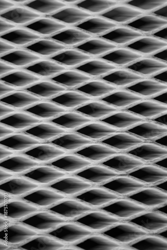 abstract blur motion for background backdrop or wallpaper grey metal grate shot on long time exposure and intentional camera movement to introduce movement and blur 