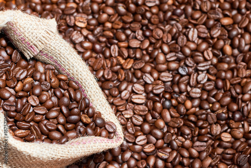 Coffee beans spilling from burlap sack