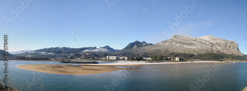 Orinon beach and mountains with winter snow