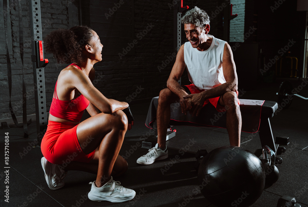 custom made wallpaper toronto digitalFit senior man in the gym with his personal trainer.