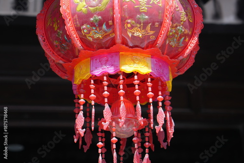 Traditional Red Chinese Lantern With Fish Ornaments Close-Up