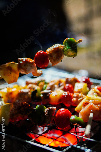 Tableau sur toile Grilled Skewers with Colorful Vegetables and Tender Meat over Charcoal