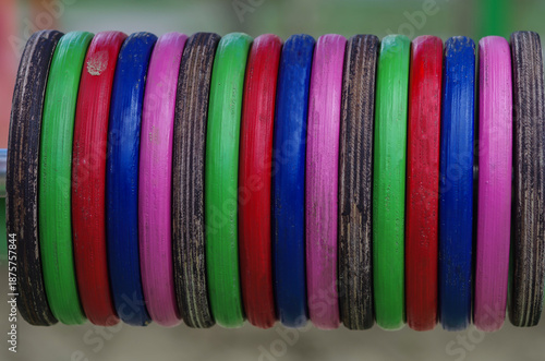 Educational games on the children's playground. Multi-colored wooden discs for counting
