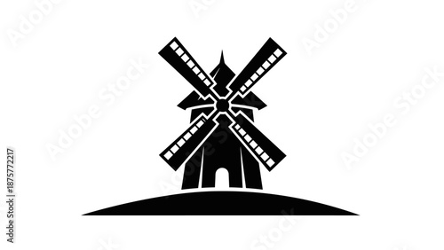 Black silhouette of a traditional windmill on a hill.