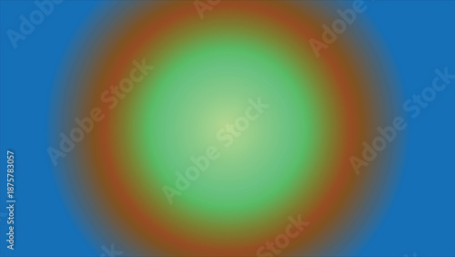 a blurry green and orange oval on a blue background