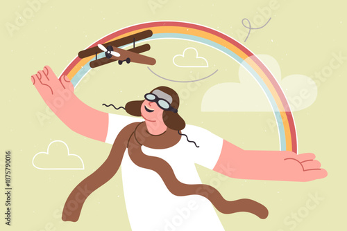 Little boy plays with airplane, imagining future career as pilot, standing near fictional rainbow