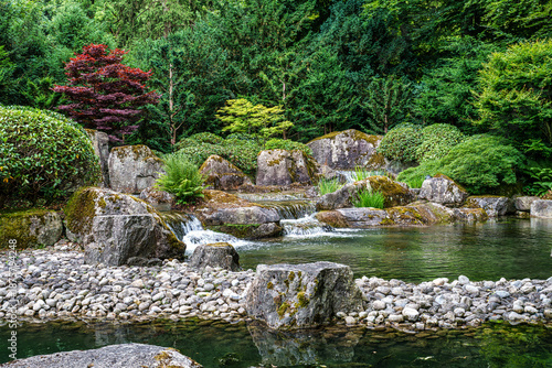 The Japanese garden in the Botanical garden in Augsburg, Germany. Lovely view on small waterfalls in japanese garden