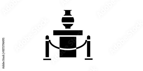 Elegant trophy on pedestal with velvet rope barrier