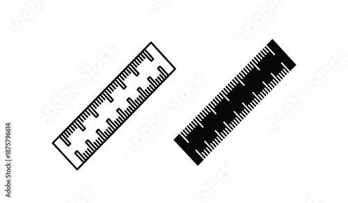 Two black and white rulers on a plain for measurement and drawing purposes in design and drafting