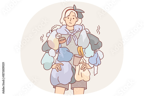 Woman wearing clothes from trash draws attention to problem recycling waste to care for environment