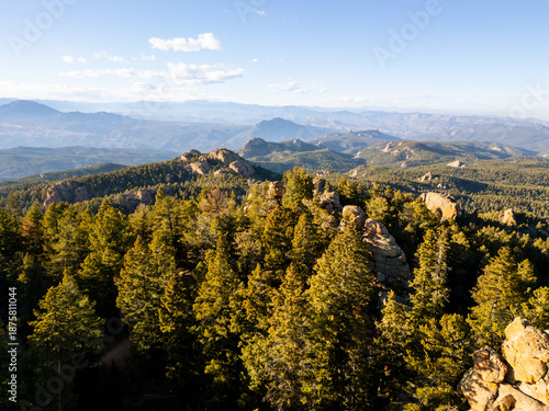 Spectacular 360-degree views from the historic Devil's Head Lookout atop a granite pinnacle in the Rampart Range of Pike National Forest, featuring rugged peaks and vast Colorado wilderness.