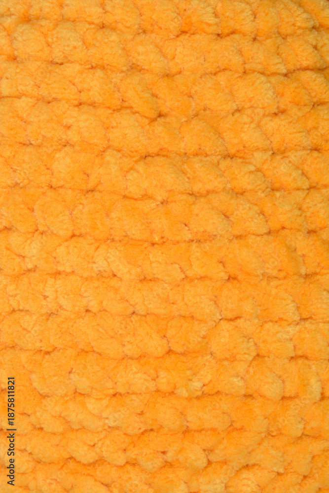 Φωτογραφία A detailed macro shot of soft yellow orange velvet chenille yarn showing its plu