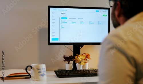 Middle-aged male doctor in home office reviews patient EMR dashboard with AI-assisted notes, vitals, labs, and visit summaries on monitor concept