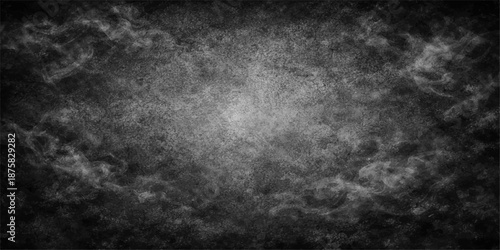 An abstract dark grunge background with a textured black and white pattern on an aged stone wall surface creating a vintage gray concrete backdrop