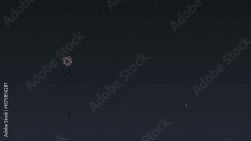 Colorful fireworks explode with heart shapes on Valentines Day night sky in celebration of love and affection