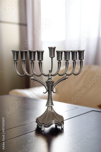 Silver menorah on wooden table