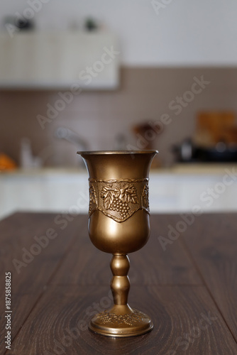 Decorative golden goblet on table