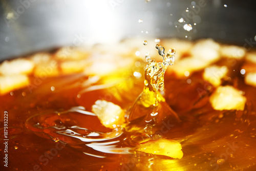Splatters occur during frying when evaporated water from the food mixes with the hot oil on the outside © taffpixture