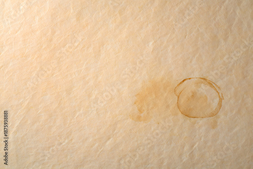 ​Warm paper texture with subtle coffee stain bottom right top left empty organic but clean