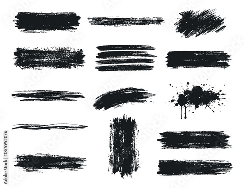 Hand drawn brush strokes set featuring various grunge textures and ink splatters for creative design