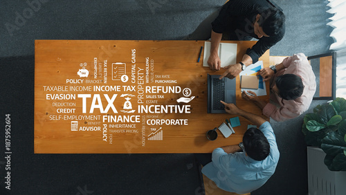 Fotografie Collaborative professionals engage in discussions centered on tax strategies, focusing on income tax, refunds, and corporate incentives in a modern office environment