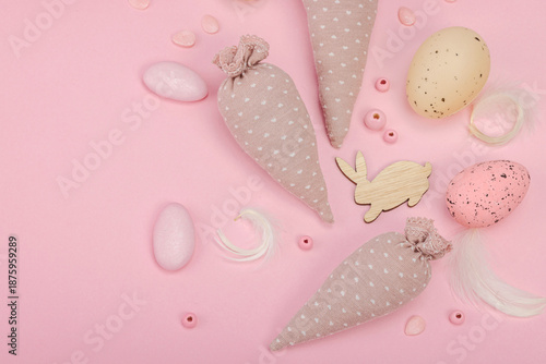 Handmade Easter concept. Sewn textile carrots with traditional decoration. Festive symbols