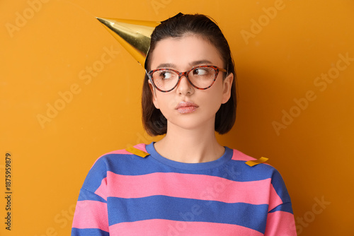 Sad young woman in party ha...