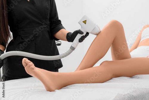 Female cosmetologist perfor...