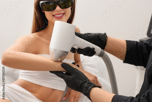 Female cosmetologist perfor...