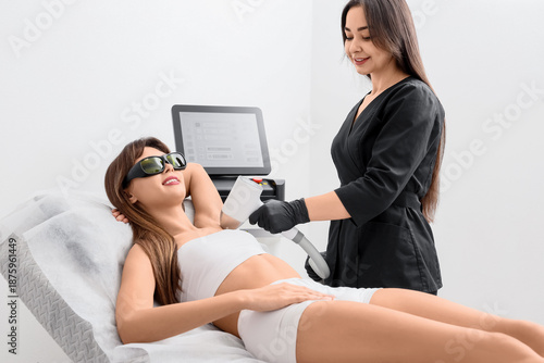 Female cosmetologist perfor...