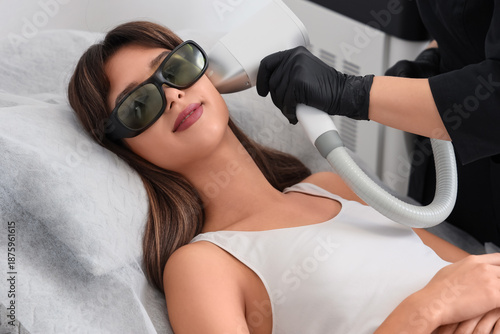 Female cosmetologist perfor...