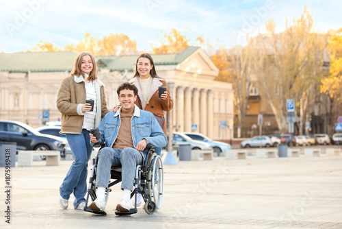 Young man in wheelchair and...