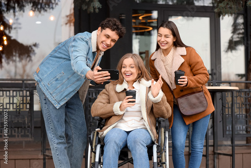 Young woman in wheelchair a...