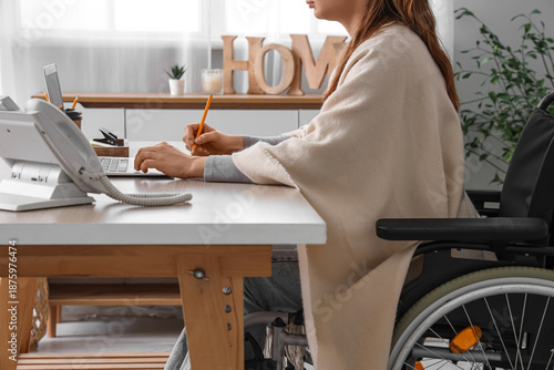 Young woman in wheelchair w...
